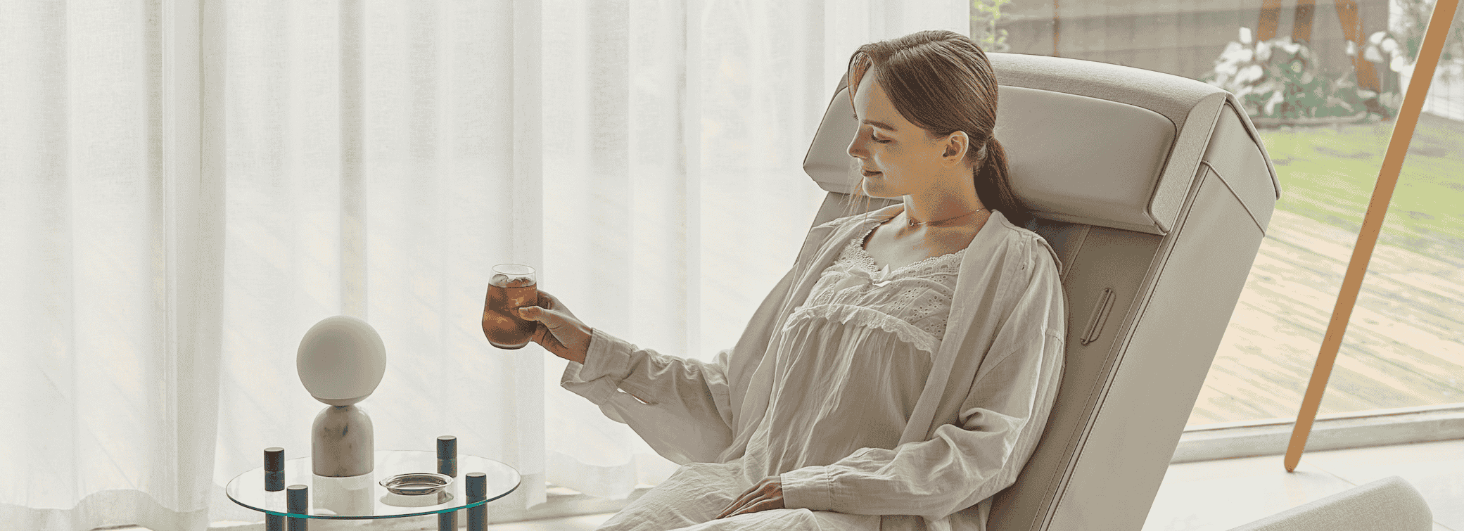 Person relaxing on Ceragem V9 spine therapy chair at home